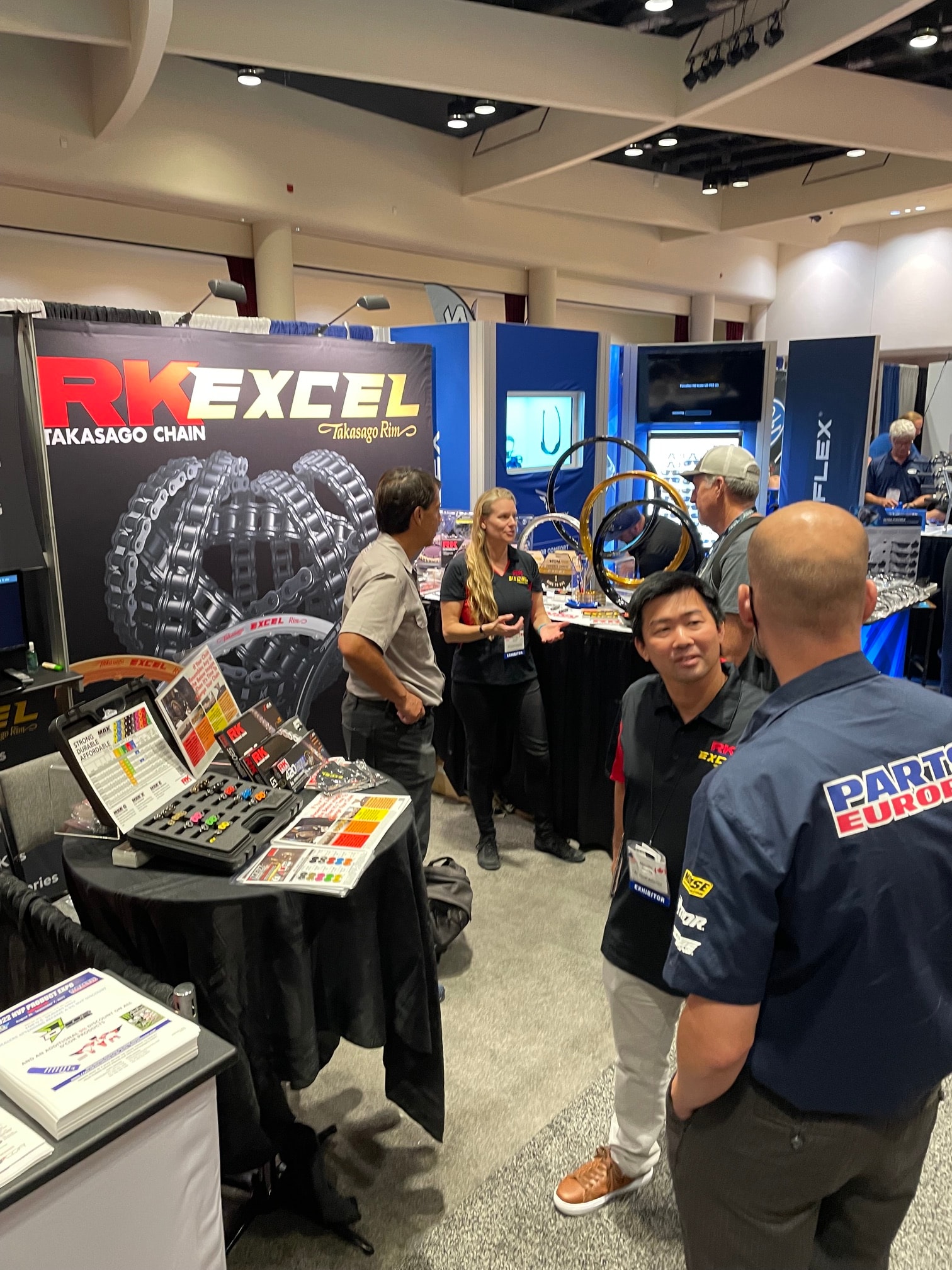 Attendees at the RK Excel / Parts Europe booth at the NVP Expo